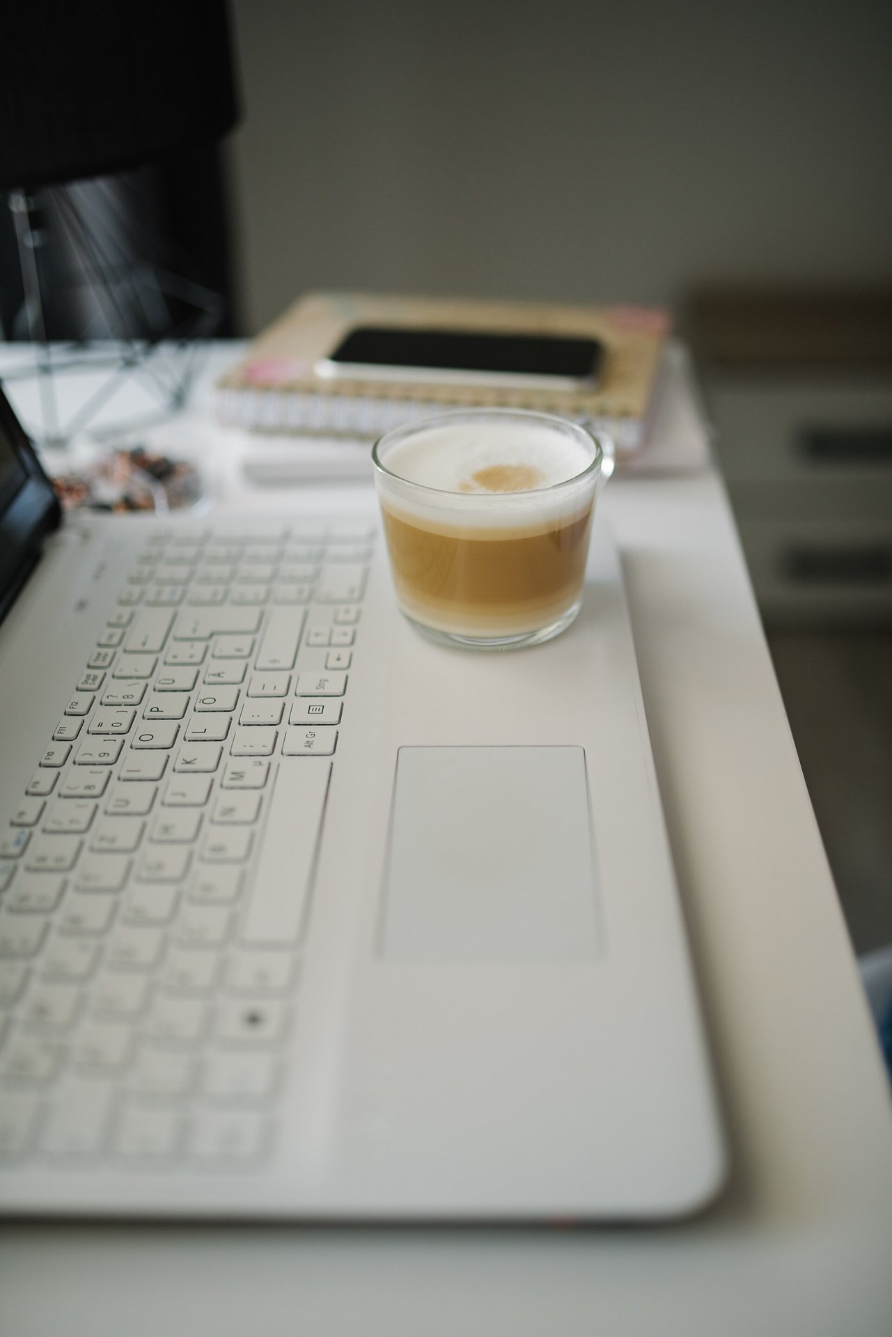 Laptop open on a workspace desk.