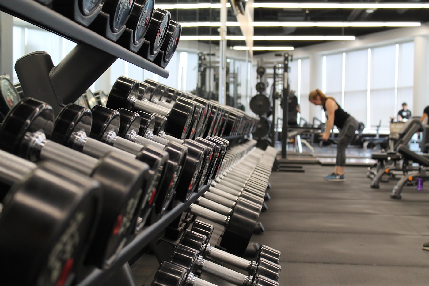 Bright athletic club floor with equipment.